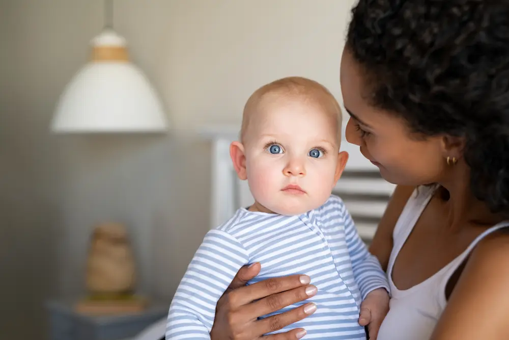 Small baby being held