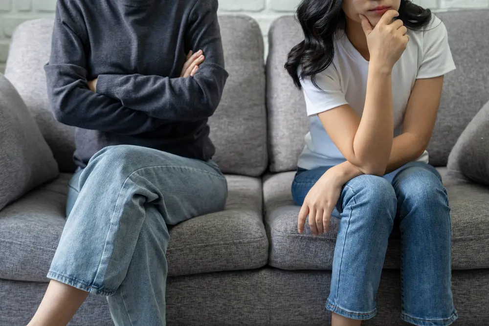 Divorced couple on sofa